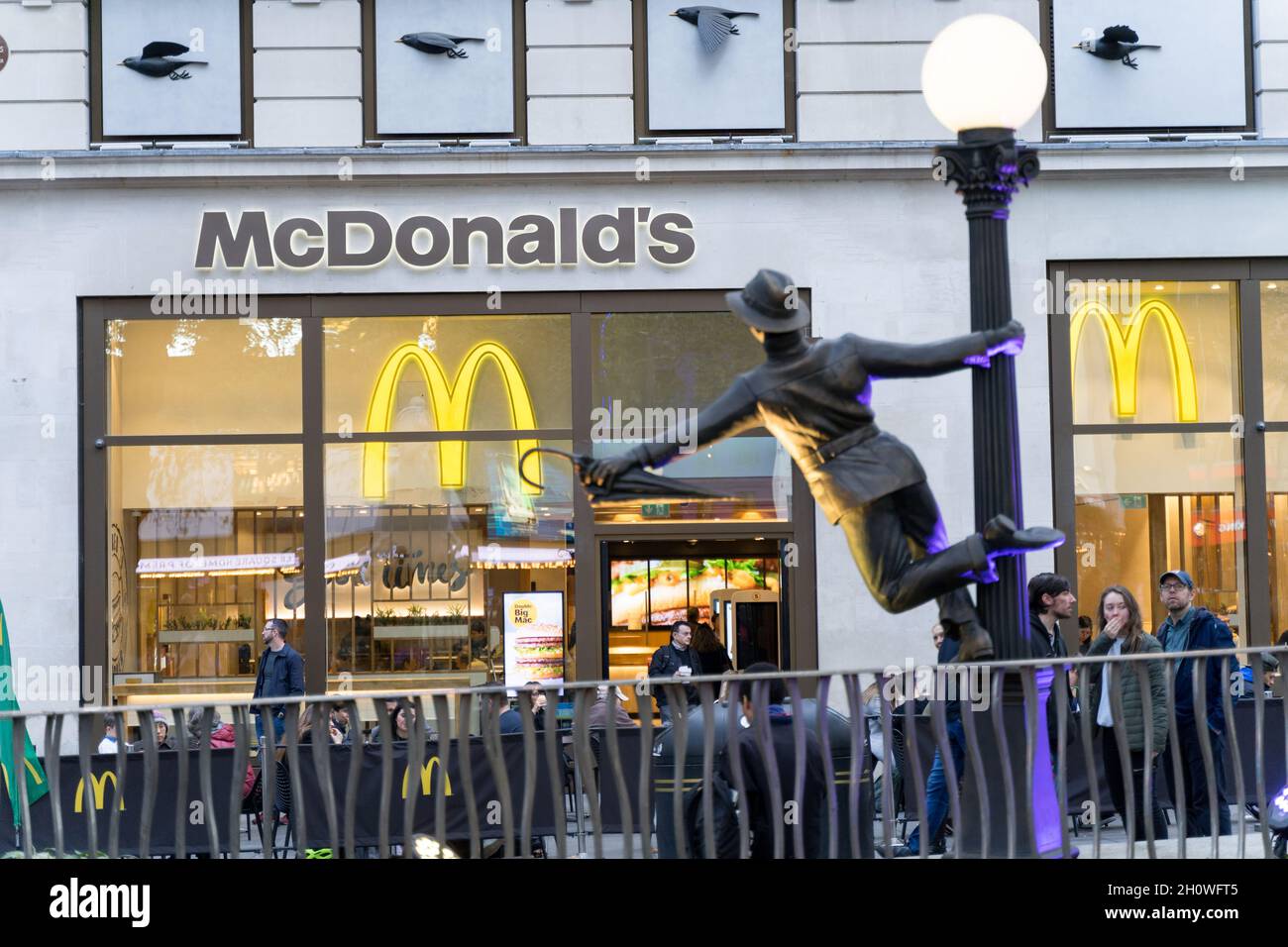 Charlie chaplin statue outside McDonald's restaurant London England UK