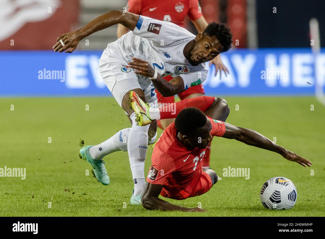 Toronto, Canada, October 13, 2021: Michael Amir Murillo (white) of Team Panama tackles Richie Laryea (red) of Team Canada for the ball during the CONCACAF FIFA World Cup Qualifying 2022 match at BMO Field in Toronto, Canada. Canada won the match 4-1. Credit: Phamai Techaphan/Alamy Live News Stock Photo