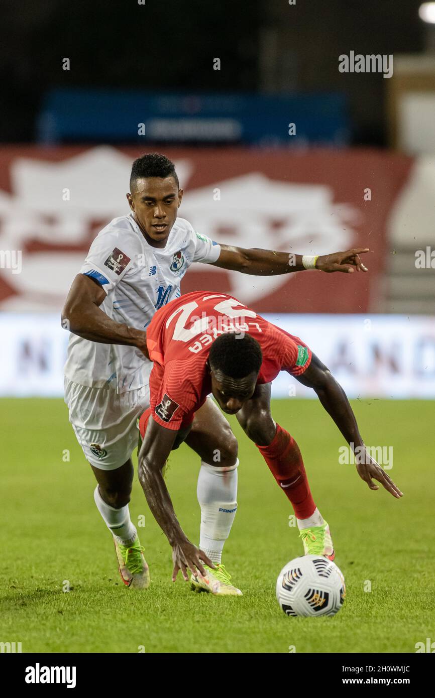 Toronto, Canada, October 13, 2021: Édgar Bárcenas, No.10, of Team Panama tackles Richie Laryea, No.22, of Team Canada for the ball during the CONCACAF FIFA World Cup Qualifying 2022 match at BMO Field in Toronto, Canada. Canada won the match 4-1. Credit: Phamai Techaphan/Alamy Live News Stock Photo