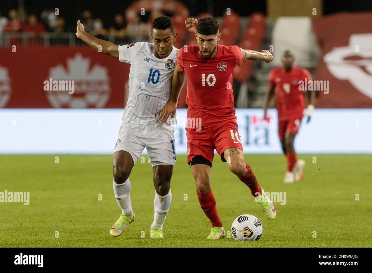 Toronto, Canada, October 13, 2021: Jonathan Osorio (R) of Team Canada and Édgar Bárcenas (L) of Team Panama compete for the ball during the CONCACAF FIFA World Cup Qualifying 2022 match at BMO Field in Toronto, Canada. Canada won the match 4-1. Credit: Phamai Techaphan/Alamy Live News Stock Photo