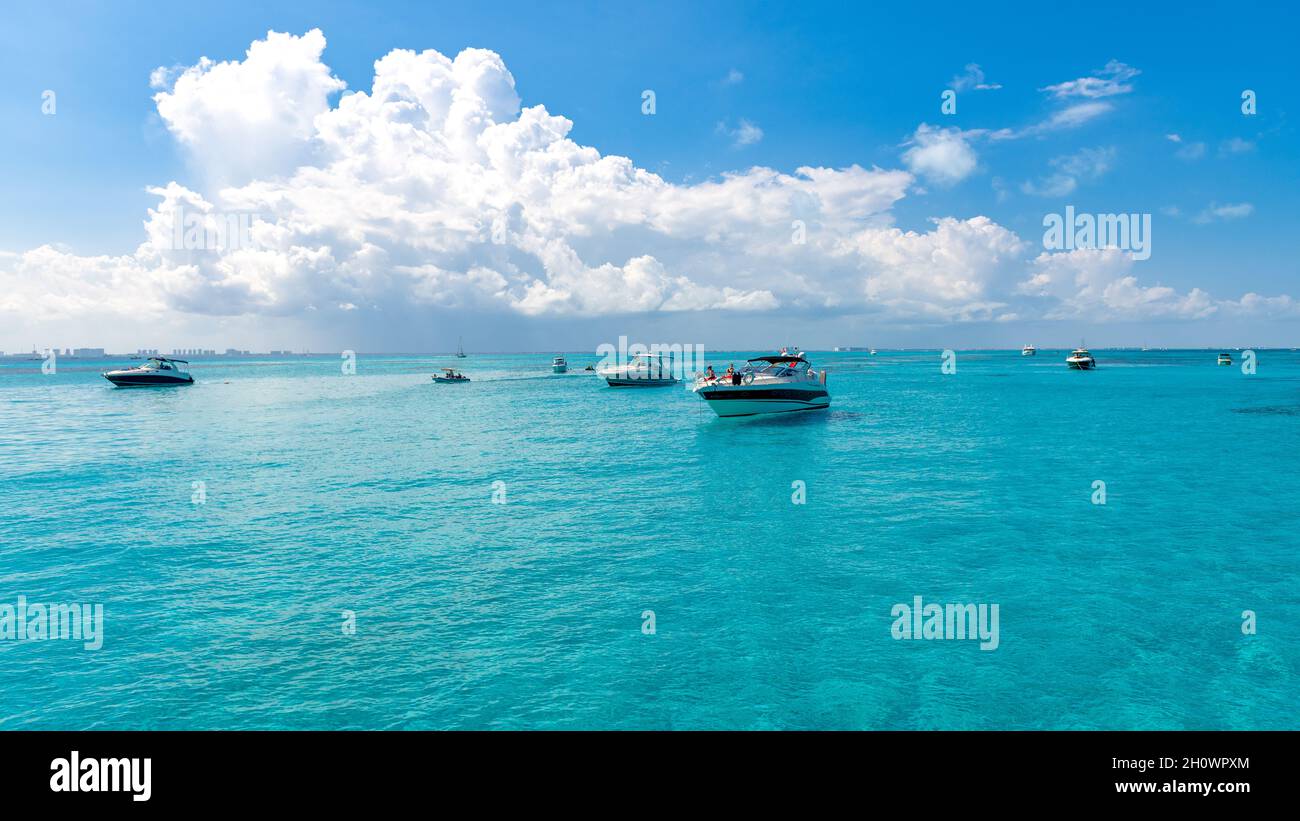 Yachts in Isla Mujeres turquoise blue water, Mexico, 2021 Stock Photo