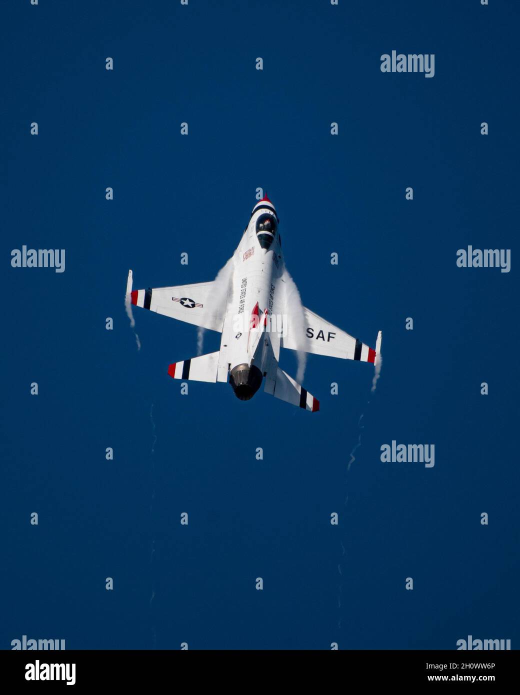 Maj. Kyle Oliver, United States Air Force Air Demonstration Squadron 'Thunderbirds' opposing solo pilot, completes a max climb split-s maneuver during the Wings Over Houston Airshow in Houston, Texas, Oct. 8, 2021. The opposing solo performs this maneuver on take-off as part of their introduction to the performance. (U.S. Air Force photo by Staff Sgt. Andrew D. Sarver) Stock Photo