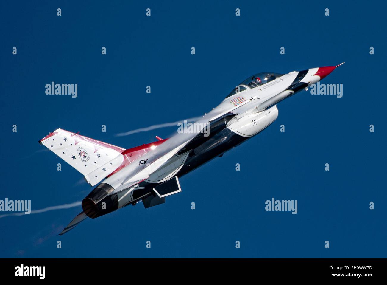 Maj. Michelle Curran, United States Air Force Air Demonstration Squadron 'Thunderbirds' lead solo pilot, pulls into a vertical orientation after the max-G turn during the Wings Over Houston Airshow in Houston, Texas, Oct. 8, 2021. The max-G turn is performed by performing a tight horizontal loop while maintaining altitude. The pilot will typically pull 9-Gs for the duration of the 360 degree turn. (U.S. Air Force photo by Staff Sgt. Andrew D. Sarver) Stock Photo