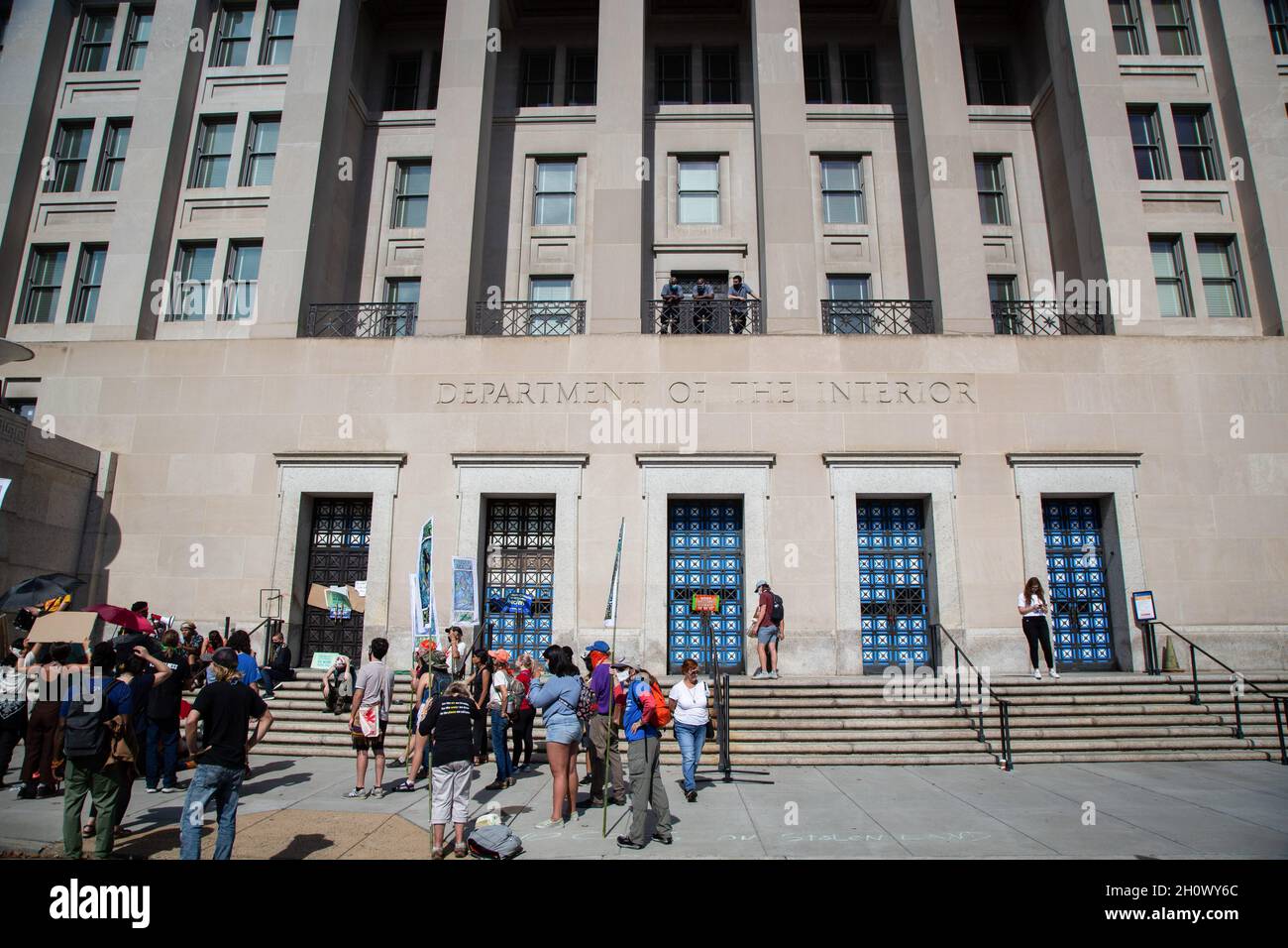 Washington, United States. 14th Oct, 2021. Protesters gather in front of the building as they take part during the demonstration. Environmental activists arrested after occupying the Bureau of Indian Affairs at the Department of Interior. Credit: SOPA Images Limited/Alamy Live News Stock Photo