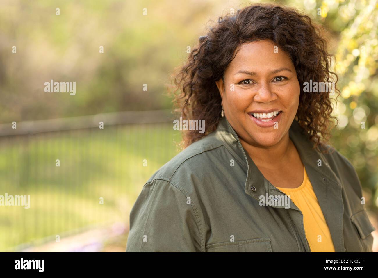 Beautiful mature African American woman smiling and laughing Stock ...