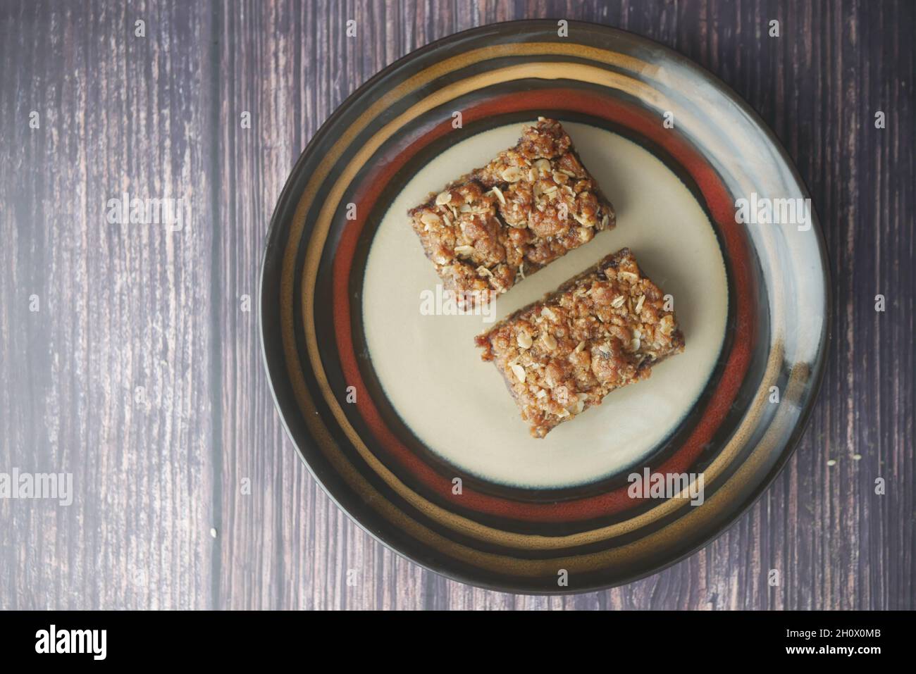 date fruit chocolate bar in a plate on table  Stock Photo