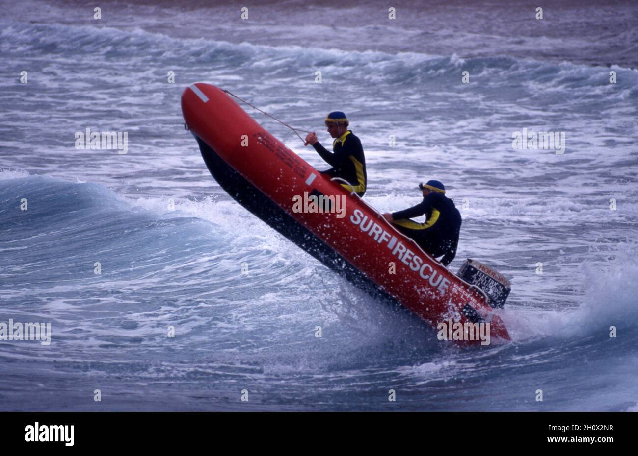 SURF LIFESAVING RUBBER DUCKIE INFLATABLE BOAT ON TRAINING EXERCISE. NEW SOUTH WALES, AUSTRALIA. Stock Photo