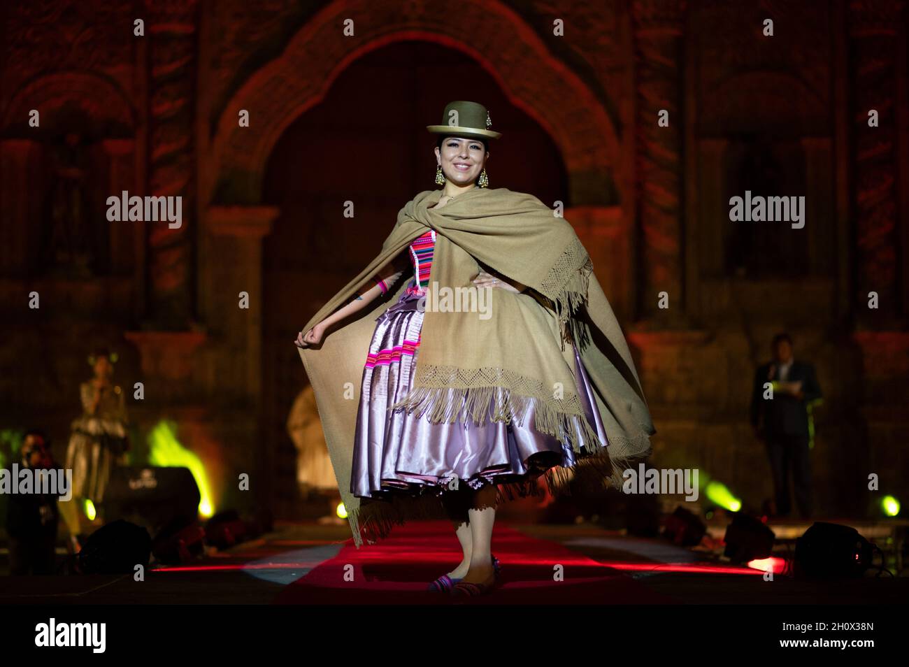 La Paz, Bolivia. 14th Oct, 2021. A model presents a typical dress during a  fashion show on the theme of cholitas. The term cholitas or cholas is used  for women who wear