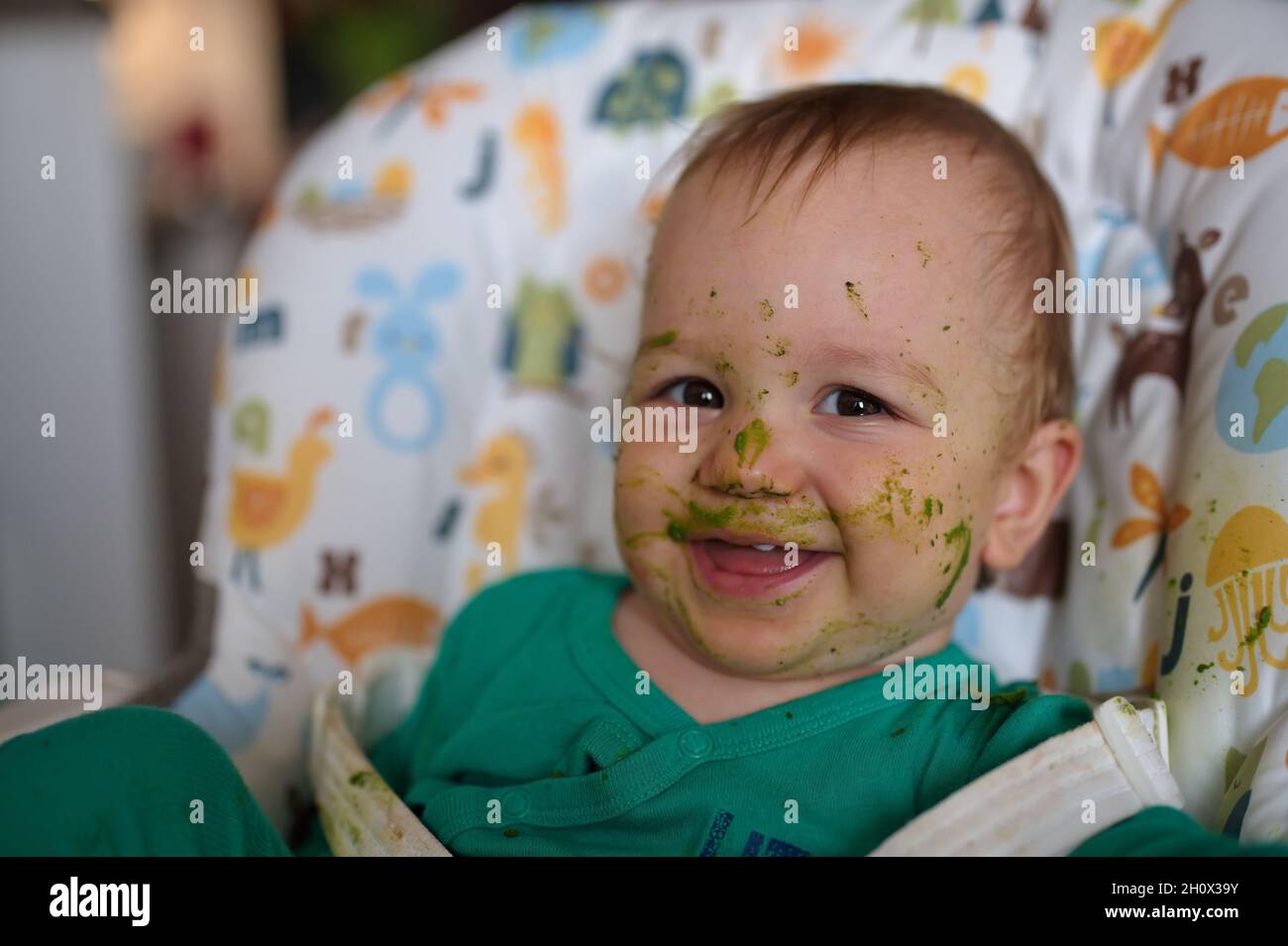 A cute little child's face stained with food Stock Photo