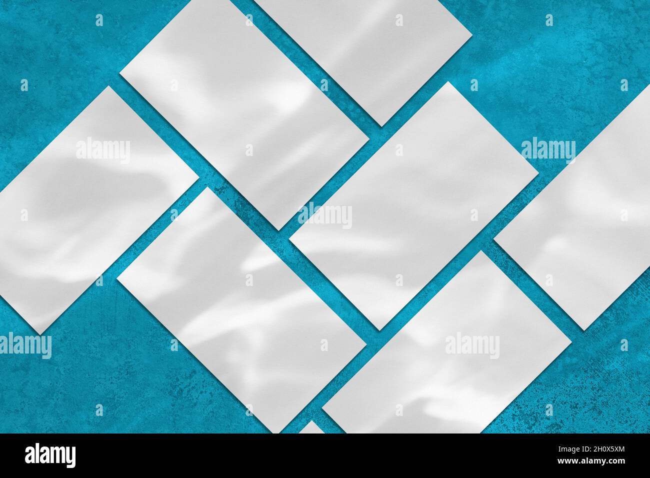 Many empty rectangle poster mockup on blue background Stock Photo - Alamy