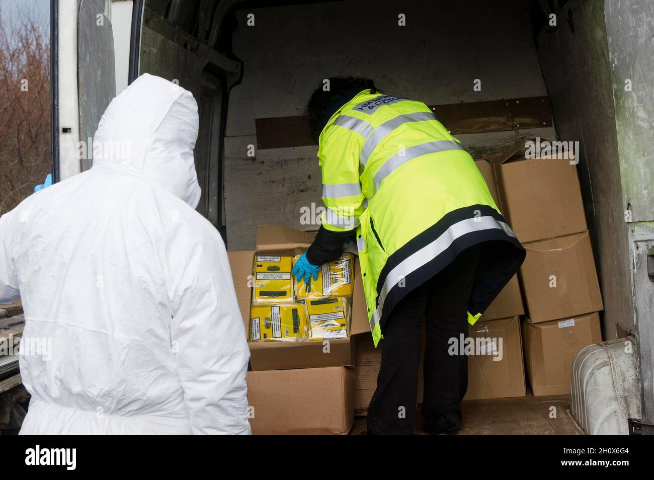 File photo dated 01/02/15 of HM Revenue and Customs officers seizing illegal tobacco. More than five million illegal cigarettes have been seized from local retail outlets in the first six months of this year, Trading Standards said. The haul of illicit products included more than 1,700kg of hand-rolled tobacco and 66kg of shisha. In total, more than £2.7 million worth of illegal tobacco products have been taken off streets across England and Wales. Stock Photo