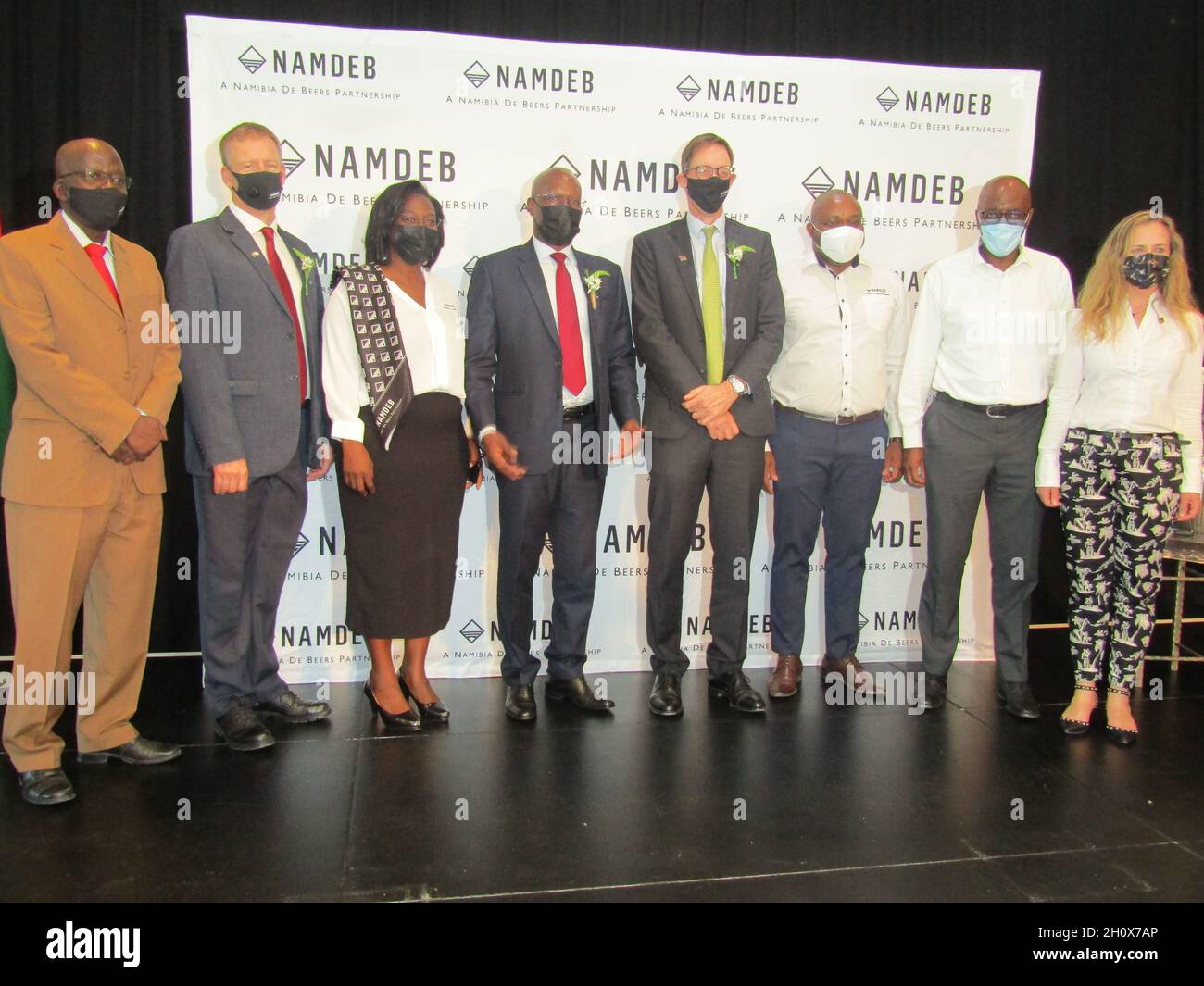 Windhoek. 14th Oct, 2021. Board members of Namibia's leading diamond miner Namdeb and executives pose for a photo during a media brief in Windhoek on Oct. 14, 2021. Namibia's leading diamond miner Namdeb, a joint-venture company of Namibian government and diamond company De Beers, on Thursday announced it would extend operations from 2022 to 2042. Credit: Musa C Kaseke/Xinhua/Alamy Live News Stock Photo