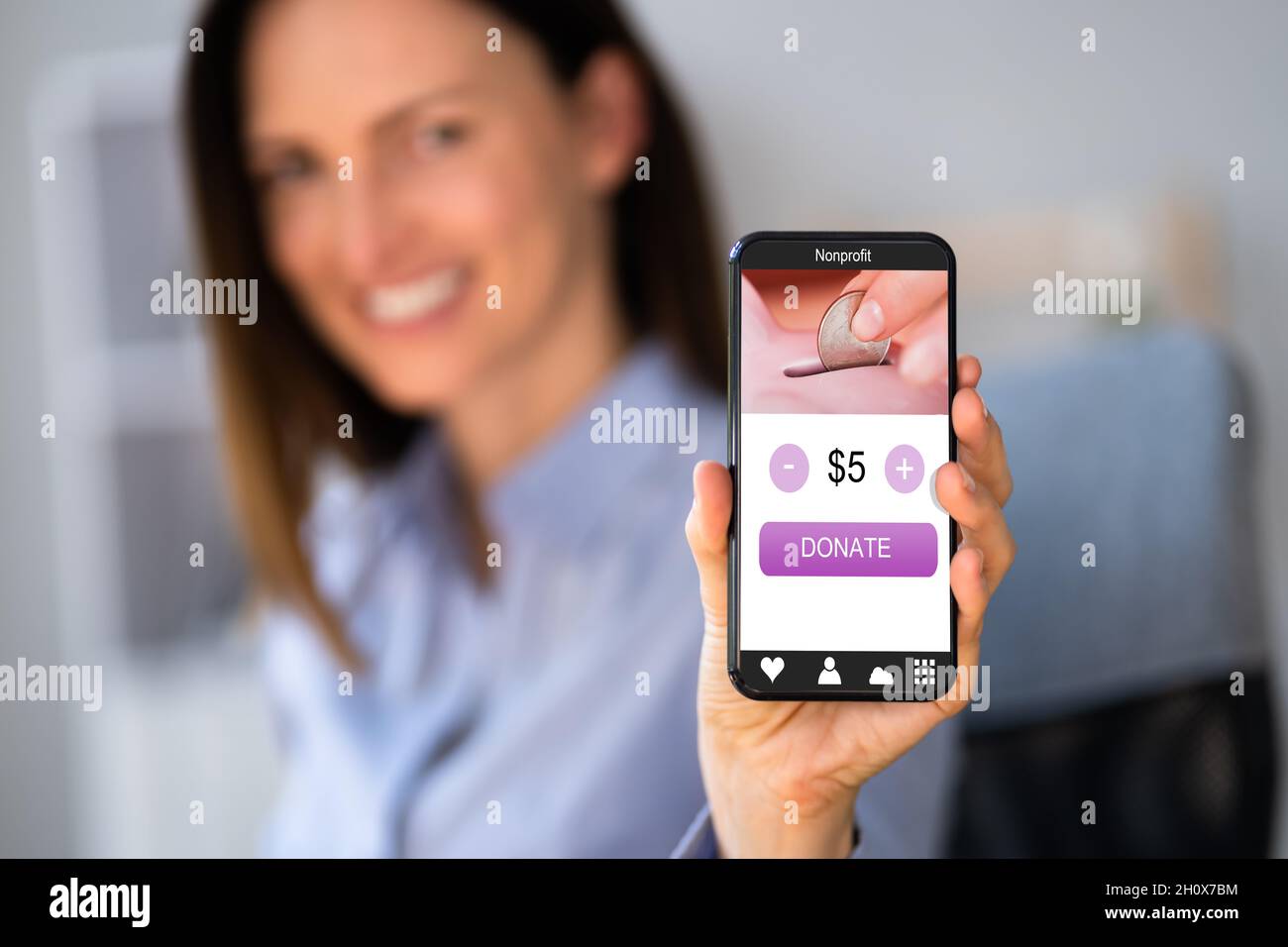 Online Nonprofit Money Giving Donate Technology On Phone Stock Photo