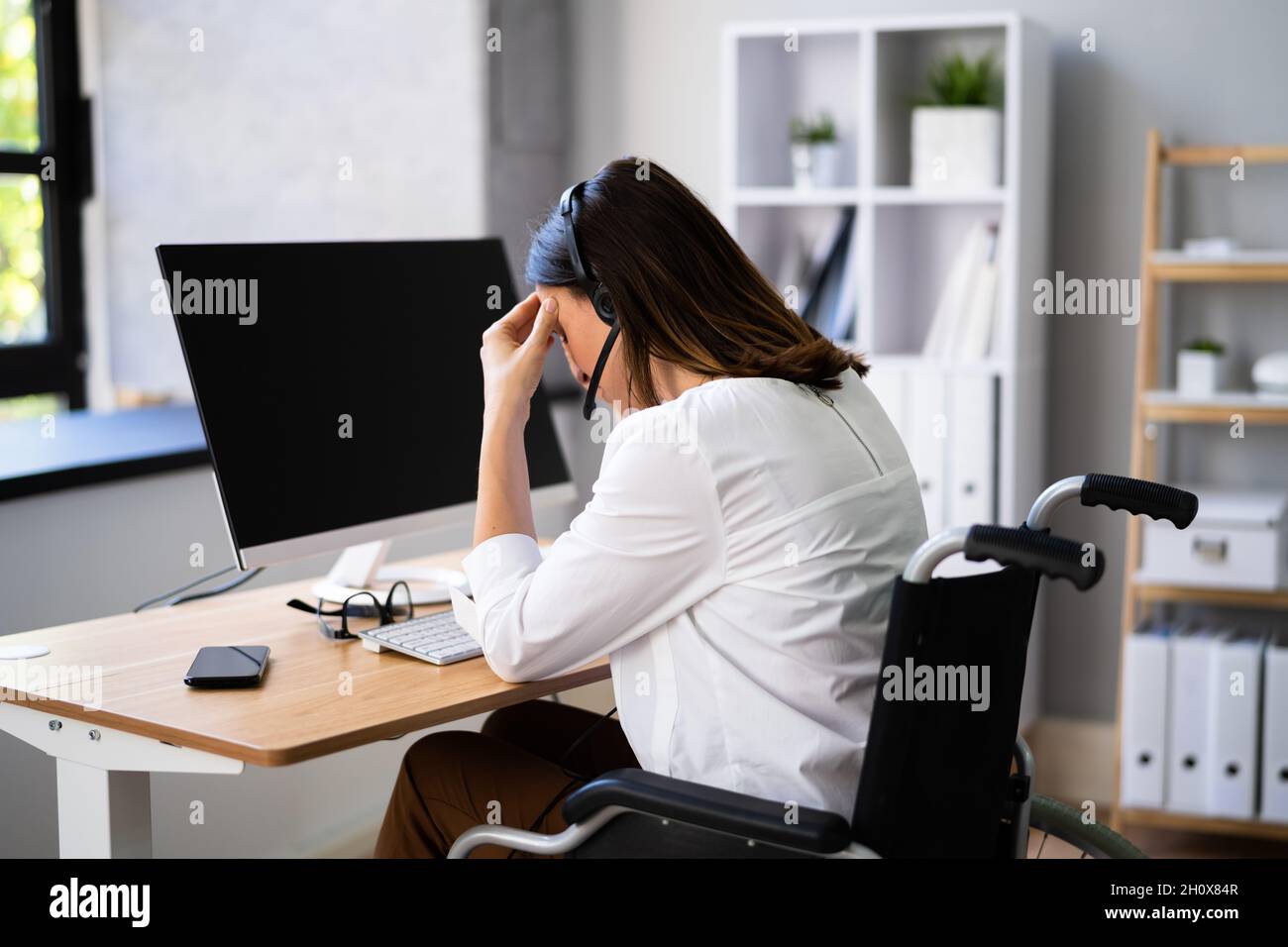 Stressful Business Woman Working On Computer In Office Stock Photo