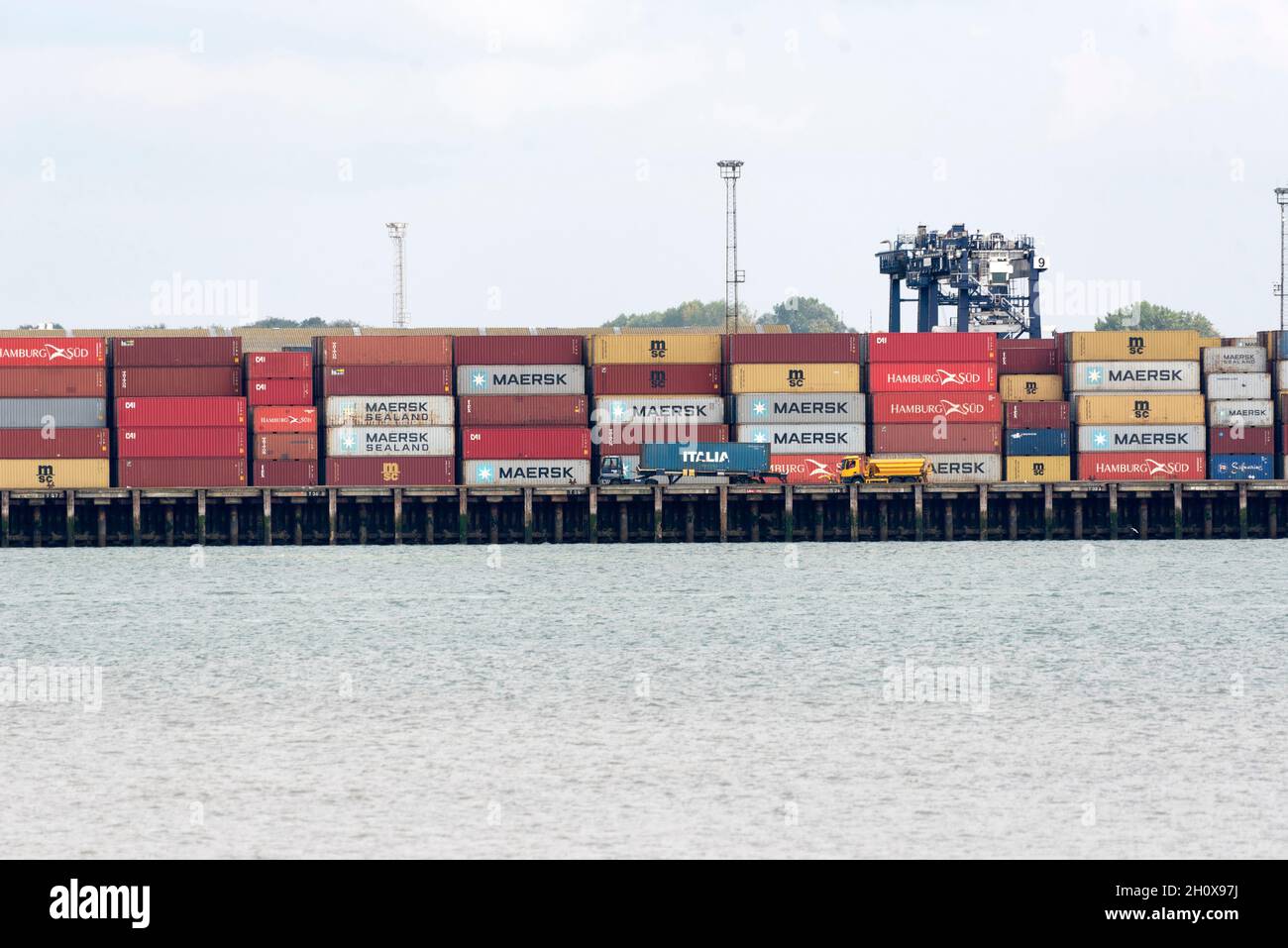 14/10/2021. Felixstowe, UK. The Port of Felixstowe has had to turn away ships from Asia because of a backlog of containers not being distributed due to the  shortage of HGV drivers. AP Moller-Maresk, the worlds largest container company has had to load containers onto smaller ships bound for the UK. This is having a disruptive effect as the shipping industry enters the pre-Christmas period of delivery with a possible shortage of Christmas goods being sold in the UK. Stock Photo