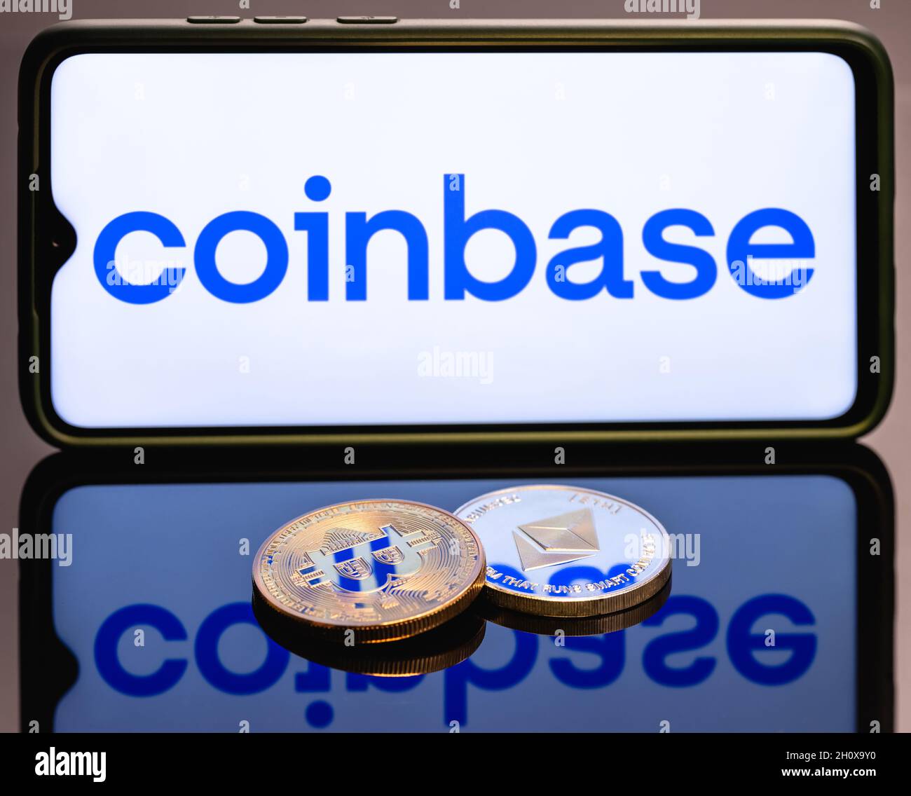 Coinbase, is an American company that operates a cryptocurrency exchange  platform. Ethereum coin and Bitcoin on the background of the coinbase logo  Stock Photo - Alamy