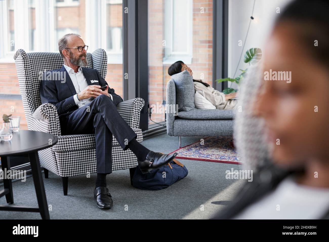 Man sitting in modern office Stock Photo