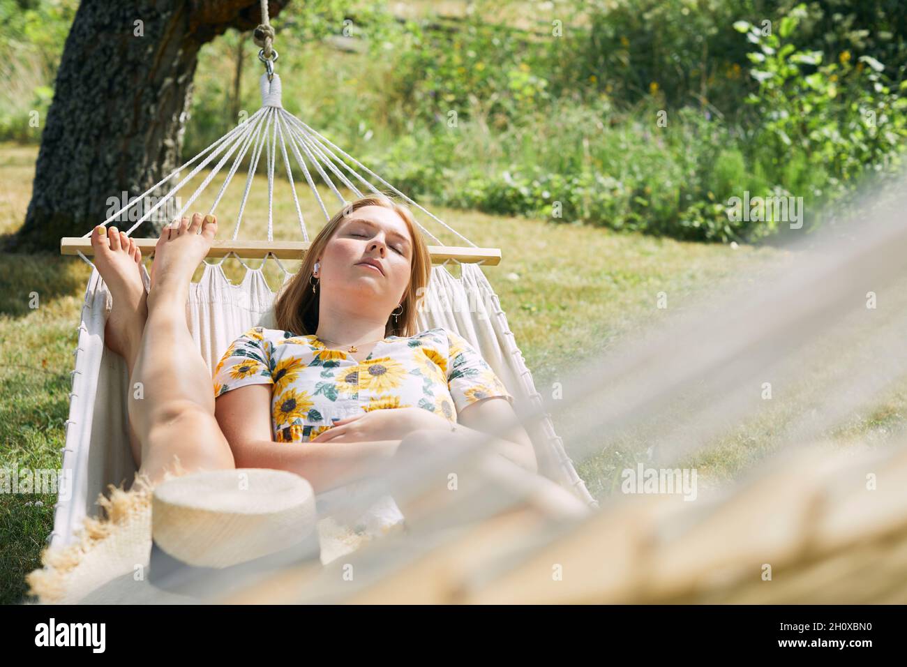 Women relaxing on hammock Stock Photo