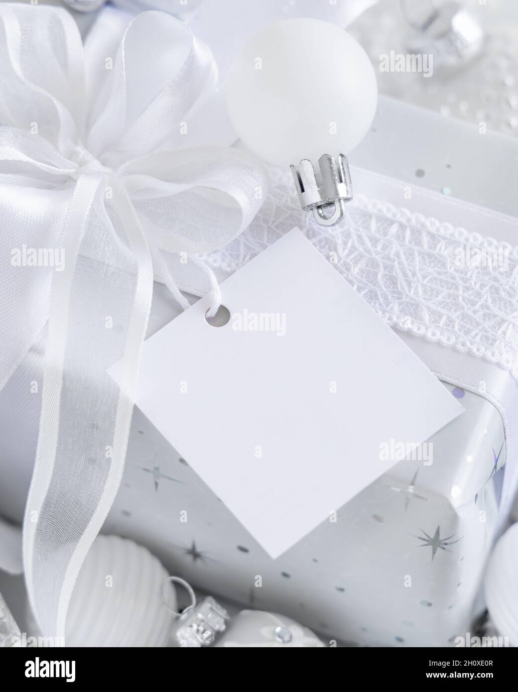 Christmas present with blue bow and silver decorations closeup Stock Photo  by katrinshine