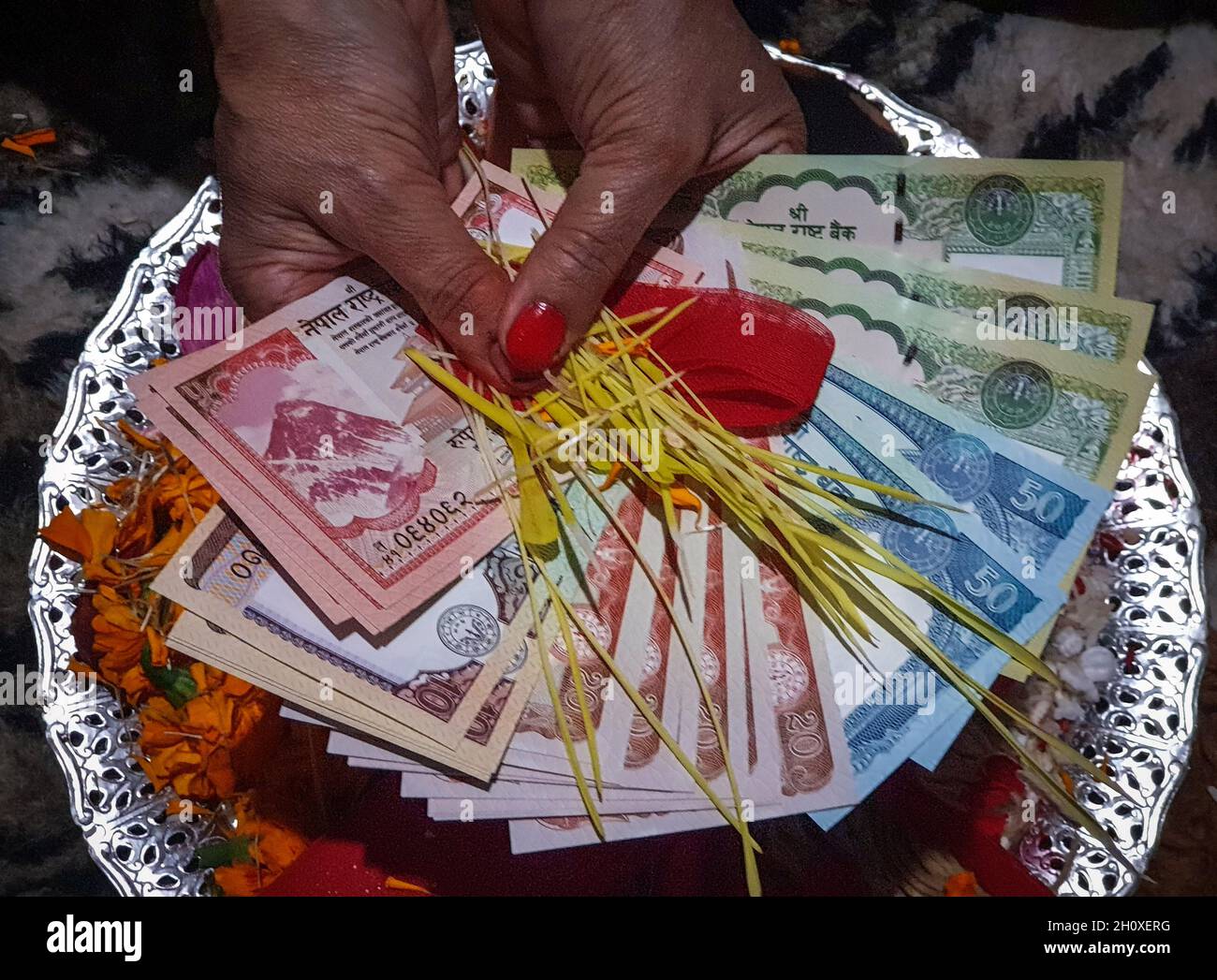 Kathmandu, Bagmati, Nepal. 15th Oct, 2021. A woman shows collection of