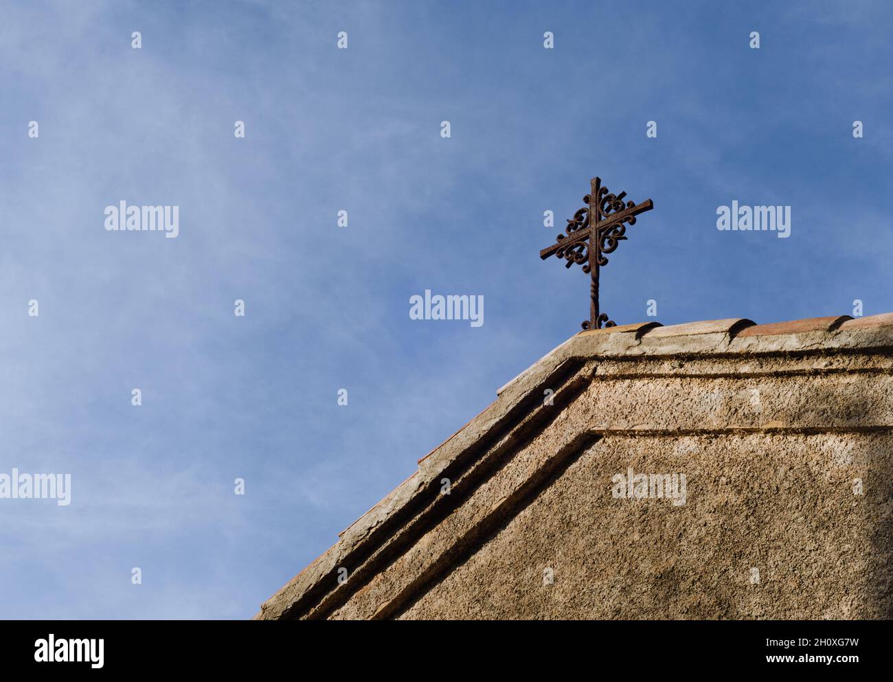 Wooden cross and sky. roof of a small church. a Christian cross. a christian cross in concept of religion and faith Stock Photo