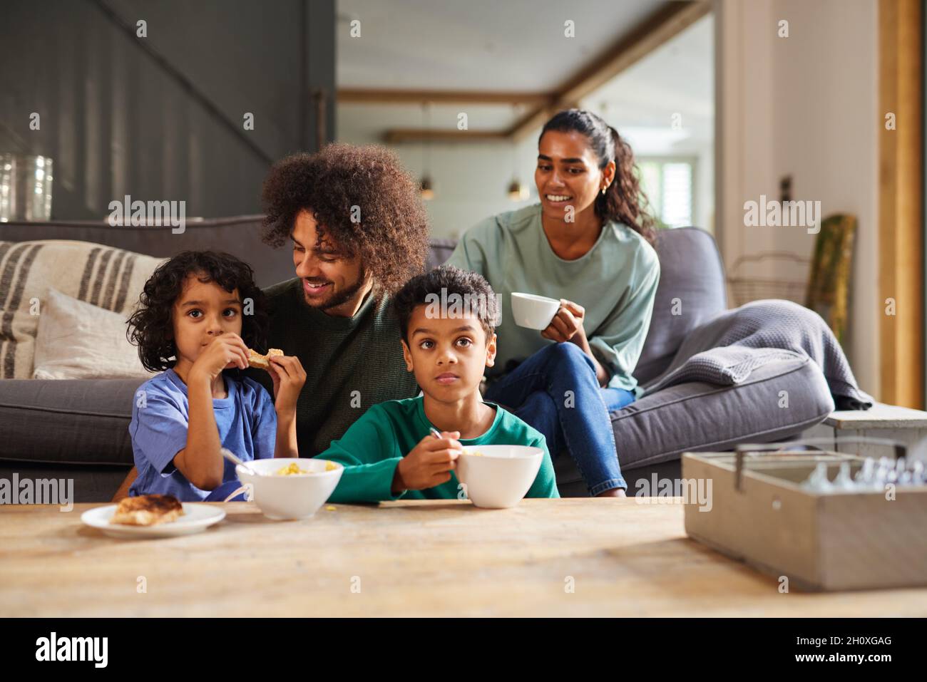 Family watching TV in living room Stock Photo