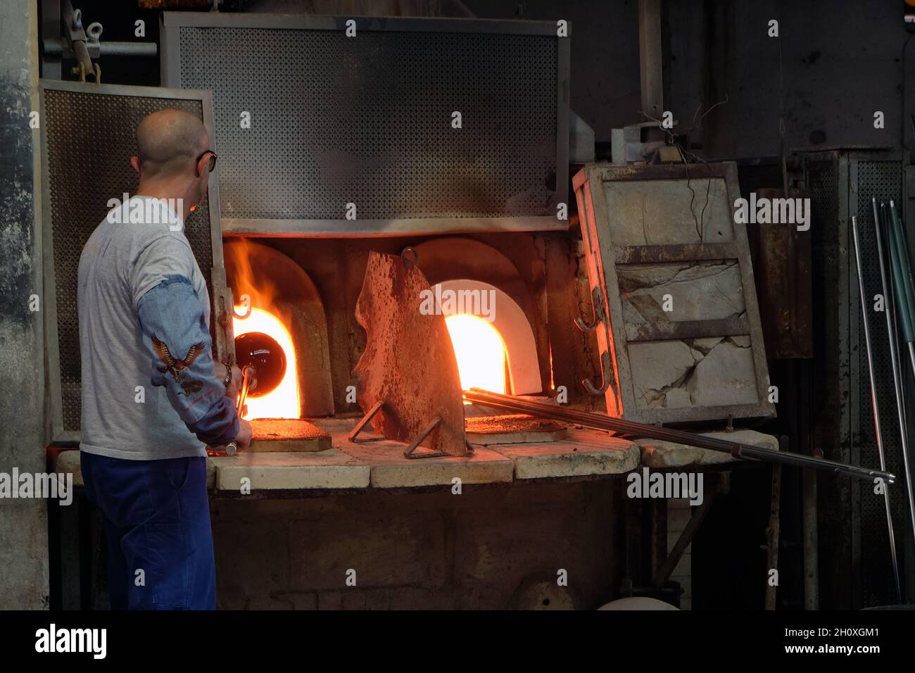 Inside Venini famous glass Factory during the Glass art Conference in Murano. Master glass