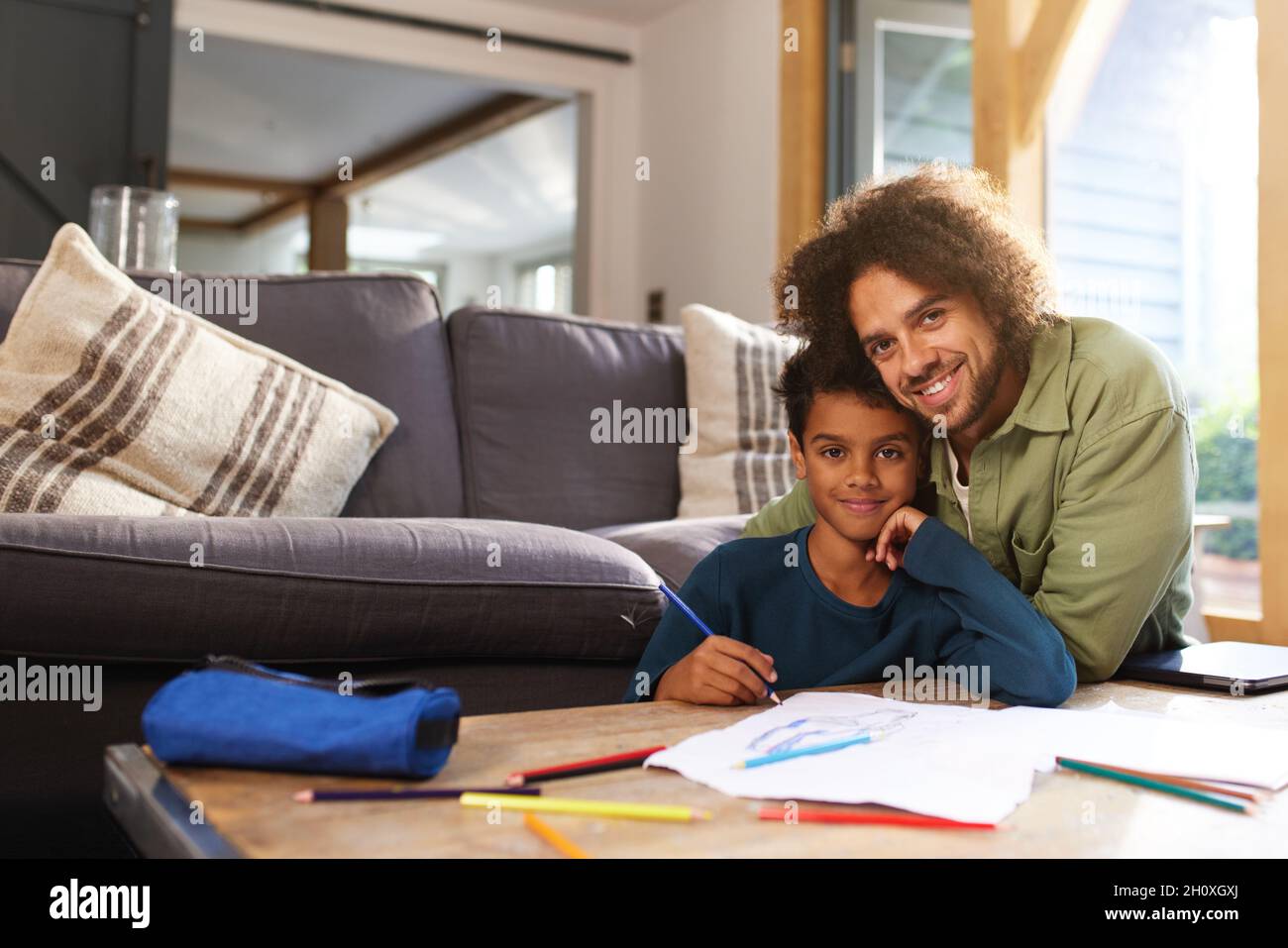 Father and son drawing at home Stock Photo