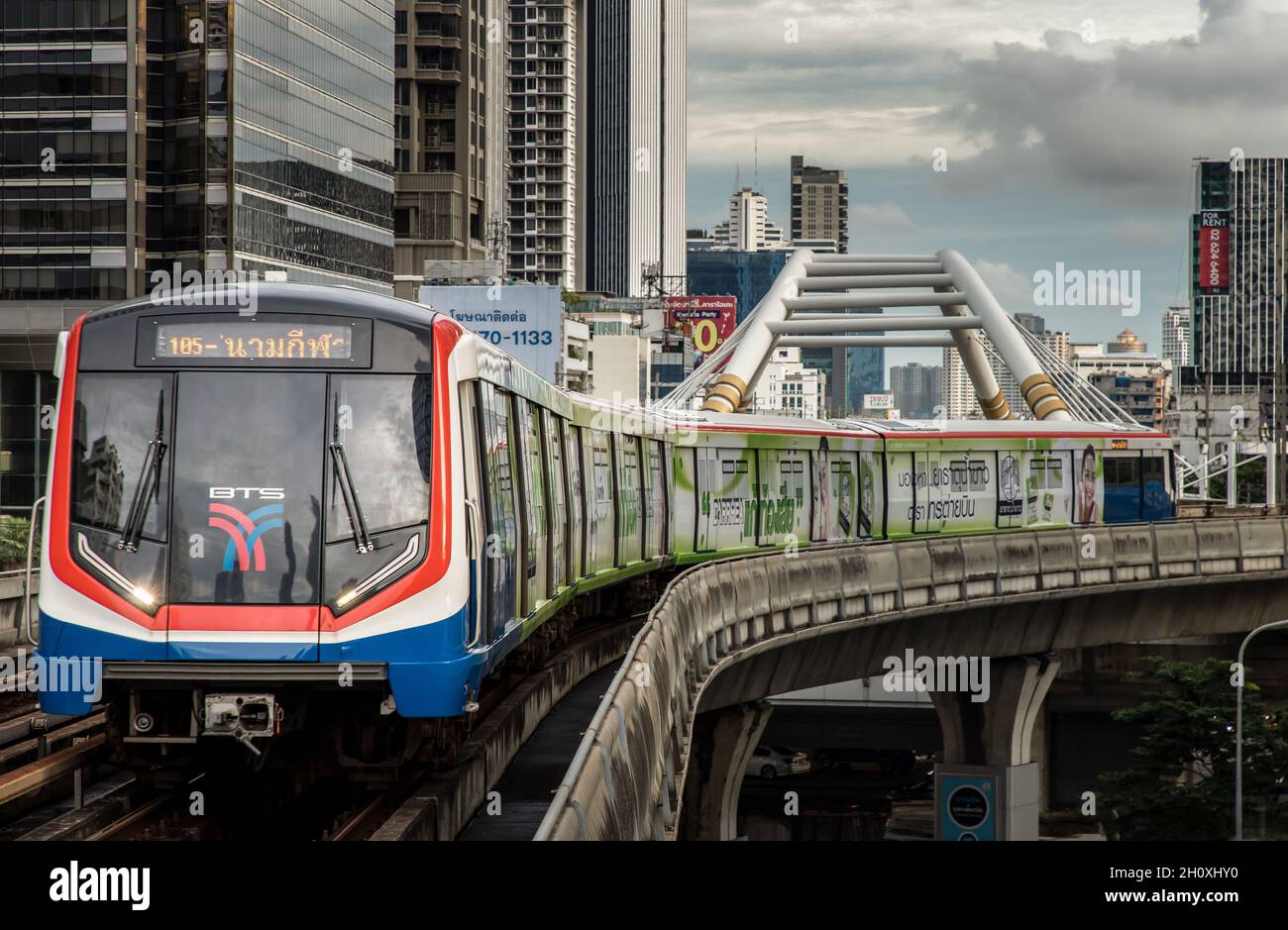 Bangkok, Thailand - Oct 03, 2020 :  BTS Sky Train is running in downtown pass through skycrapers business building in central business district of Ban Stock Photo