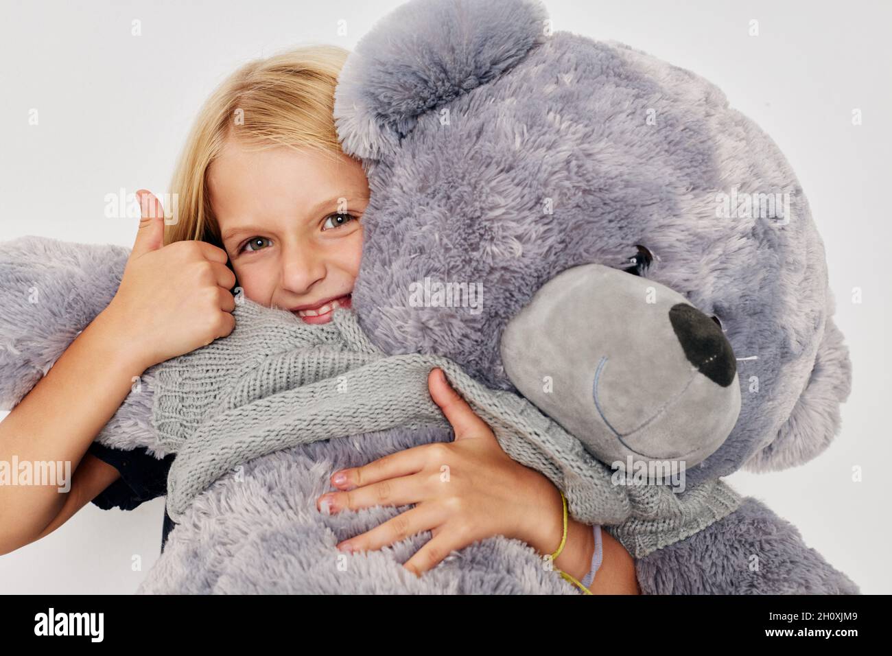 emotional girl teddy bear in the hands 
