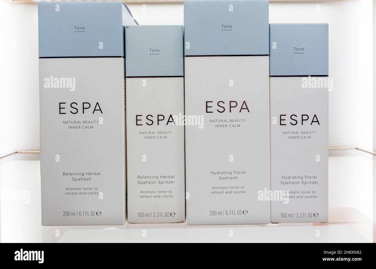 ESPA skin and face care beauty products and moisturizers, packaged on a shelf. Stock Photo