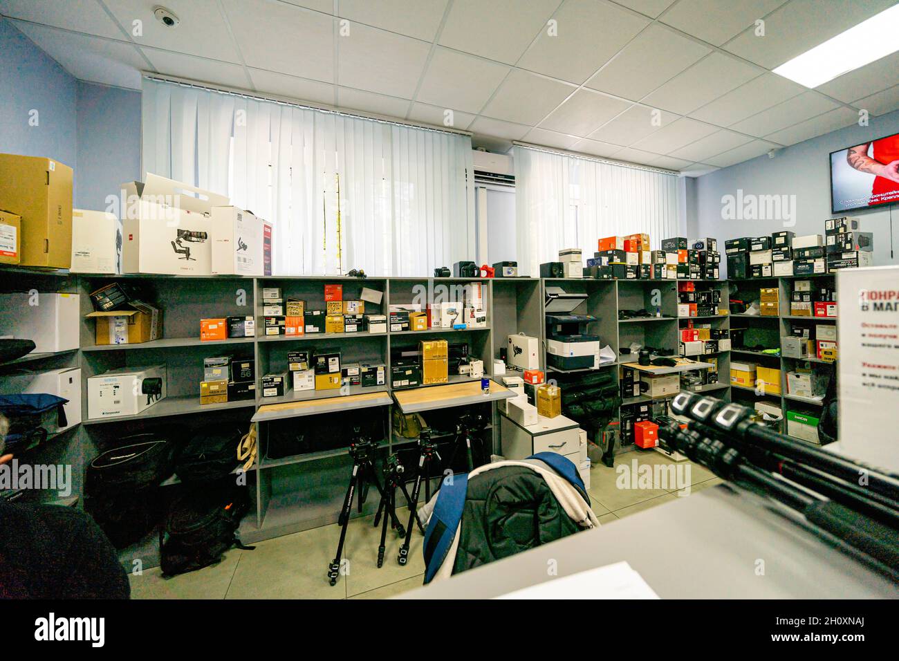 Photo equipment on shelves in the photo and video rental shop store, interior, Moscow, Russia Stock Photo