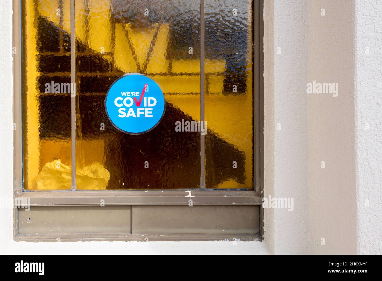 A Covid Safe sign in the window of the Armenian Apostolic Church in Chatswood, Sydney, Australia Stock Photo