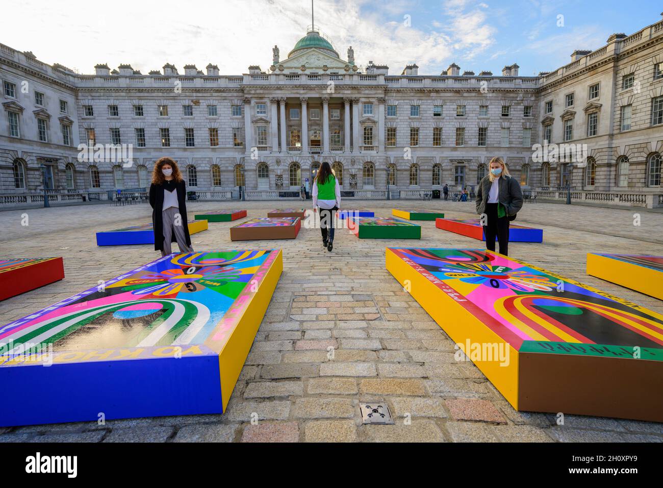 A large scale painting on 20 panels by Lakwena Maciver covers the