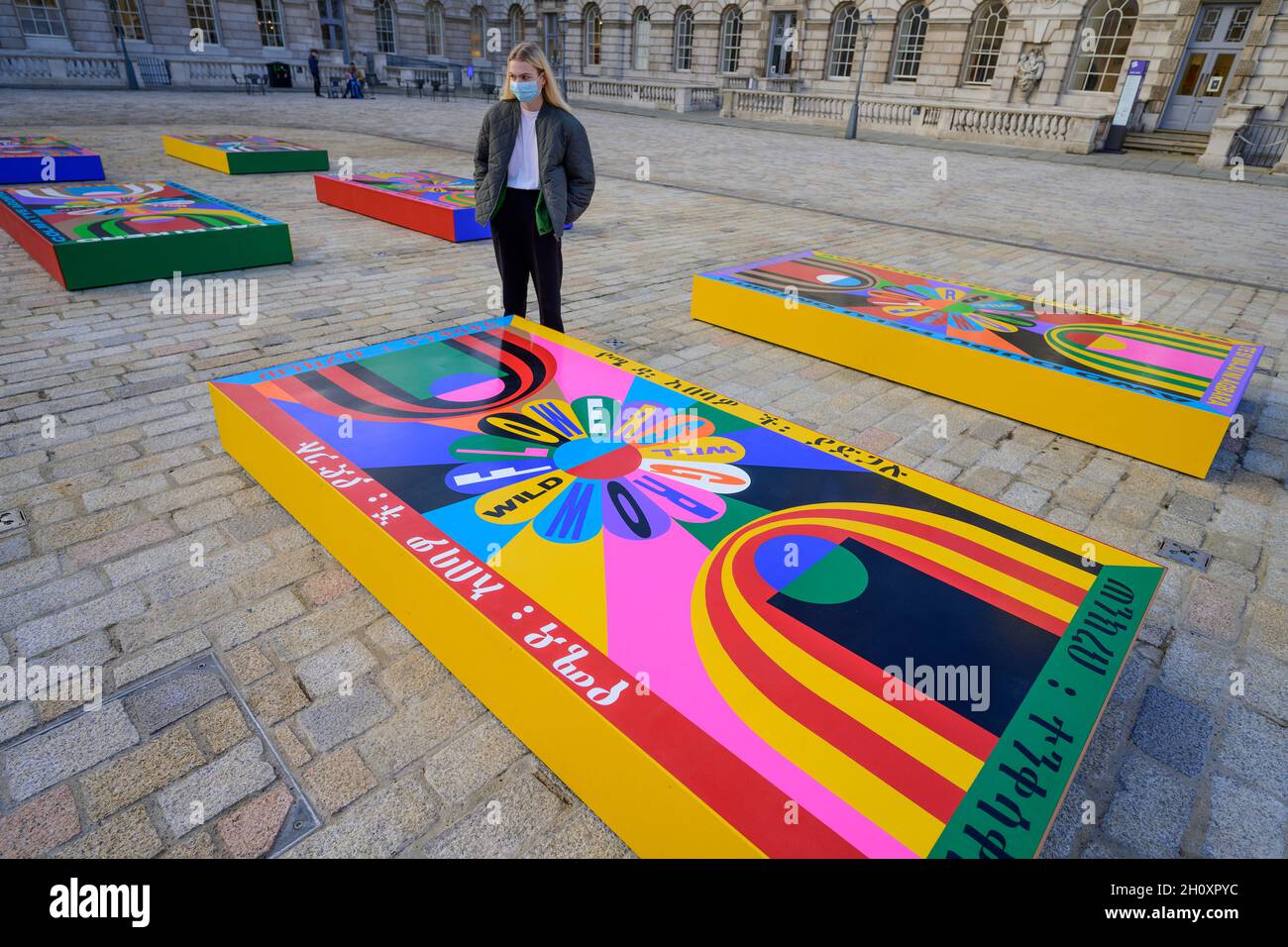 A large scale painting on 20 panels by Lakwena Maciver covers the