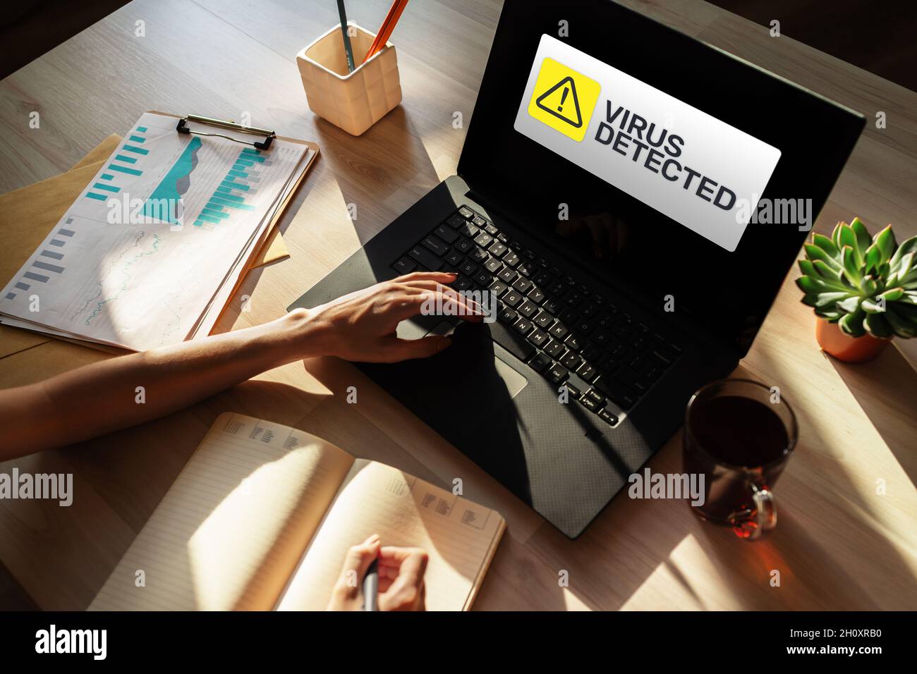 Virus Detected warning message on screen. Cyber security breach. Data protection internet and technology concept. Stock Photo
