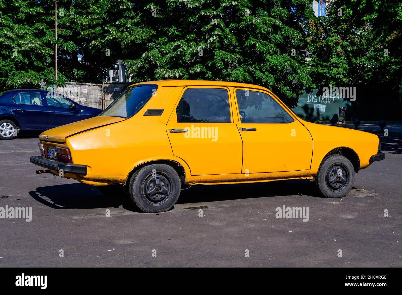 Bucharest, Romania - 5 June 2021: Old retro vivid yellow orange Romanian Dacia  1300 classic car parked in a street in a sunny summer day Stock Photo -  Alamy