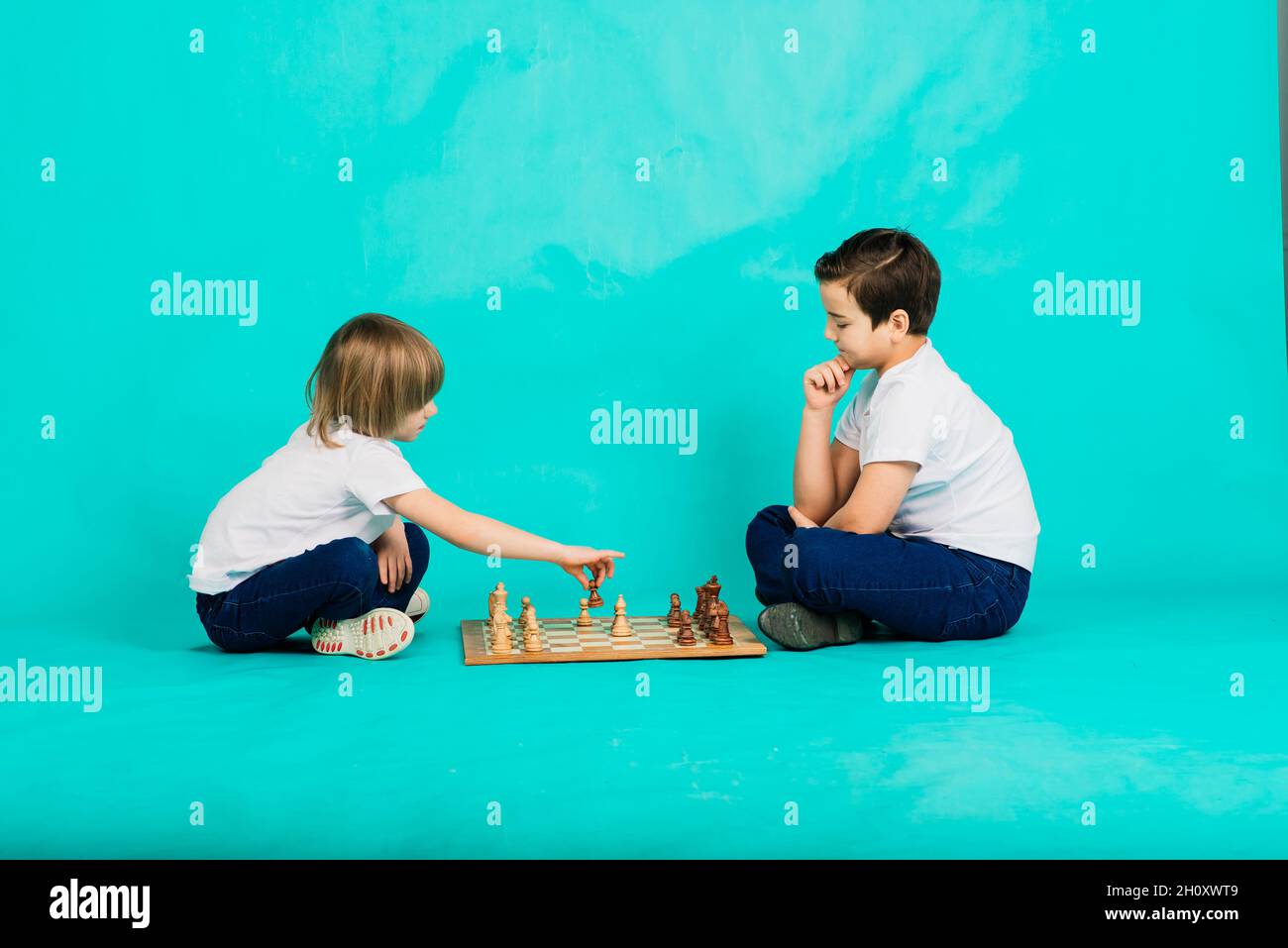 Two boys play board game hi-res stock photography and images - Alamy