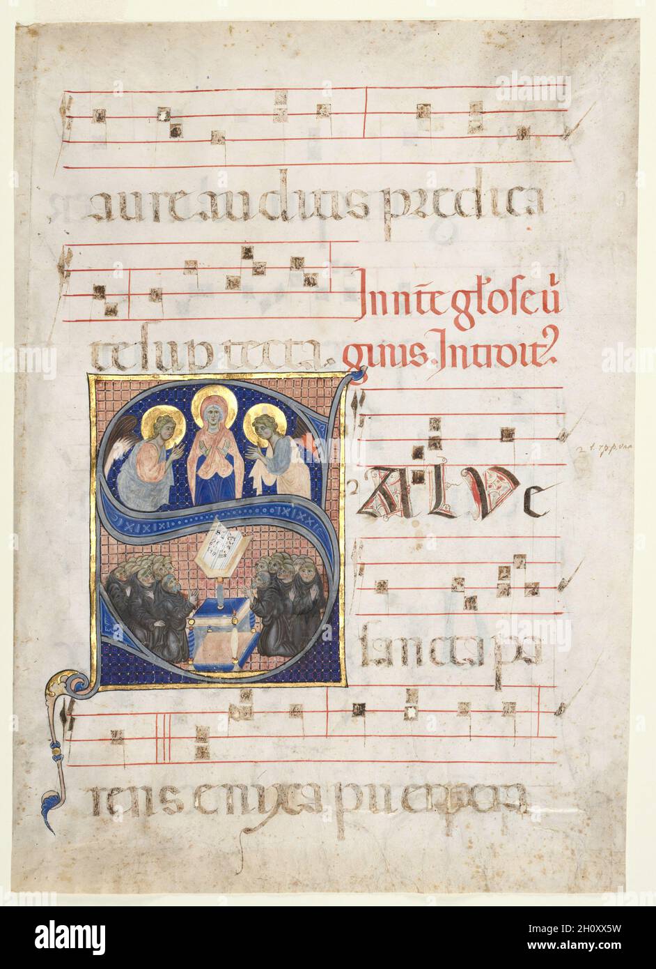 Initial S[alve sancta parens] with the Virgin Adored by Angels, and Singing Benedictine Monks: Single Leaf from a Gradual, c. 1270. South Italy, 13th century. Ink, tempera, and gold on parchment; sheet: 47 x 34 cm (18 1/2 x 13 3/8 in.).  This large initial S introduces the introit (beginning) for a Saturday Votive Mass of the Virgin Mary. The text begins Salve sancta parens...(Hail Holy Parent [Mother]...). The double curve of the letter creates two registers for the representation of independent scenes. The initial is set within a rectangular frame and against a background of diapers (geometr Stock Photo
