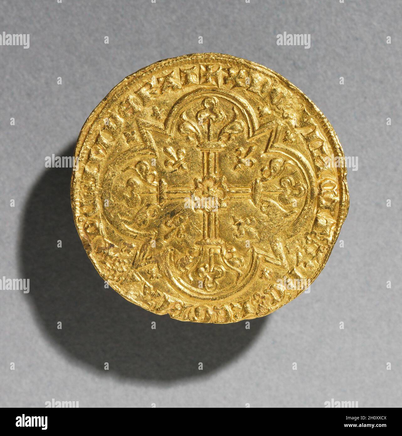 Mouton d'Or of King Jean le Bon of France, 1350-1364 (reverse), 1350-1364. France, Gothic period, 14th century. Gold; diameter: 3.1 cm (1 1/4 in.).  Because this gold coin represents the Paschal Lamb, a symbol of Christ, on one of its faces, it is known as a 'Golden Sheep'--Mouton d'Or in French. Stock Photo