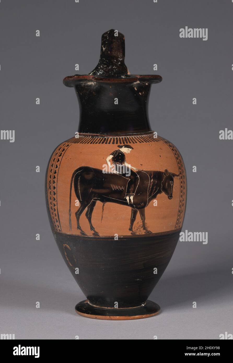 Black-Figure Trefoil Oinochoe (Wine Jug): Europa on Bull, c. 530 BC. Attributed to Class of Vatican 440 (Greek, Attic). Ceramic; overall: 23.6 cm (9 5/16 in.).  Zeus, in the form of a bull, abducts Europa. Stock Photo