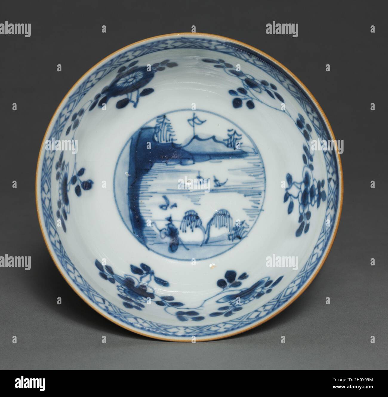 Bowl with Floral Sprays and Medallions with Figure in Landscape, 1723-35. China, Jiangxi province, Jingdezhen kilns, Qing dynasty (1644-1911), Yongzheng mark and reign (1723-35). Porcelain with underglaze blue decoration (interior) and café-au-lait glaze (exterior); diameter: 14.6 cm (5 3/4 in.); overall: 7 cm (2 3/4 in.). Stock Photo