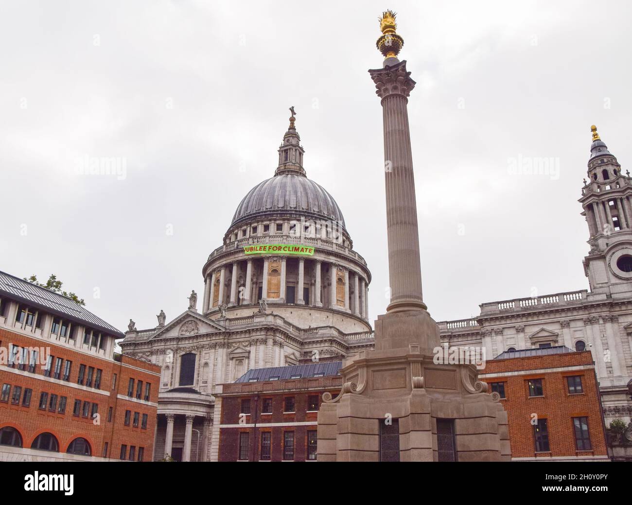 London, UK. 15th Oct, 2021. A banner hangs on St Paul's Cathedral. Activists launched the Jubilee For Climate campaign, calling for the cancellation of all unfair debts, system change, transformation of the economy, and firm action on the climate and ecological crisis. Credit: Vuk Valcic/Alamy Live News Stock Photo