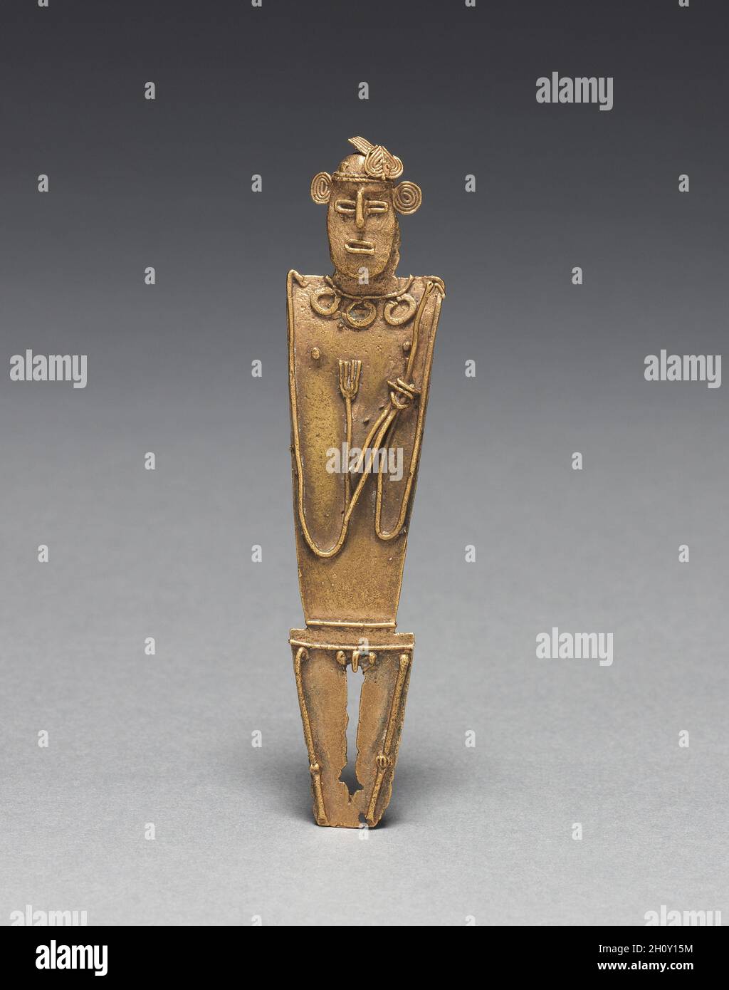 Tunjos (Votive Offering Figurine), c. 900-1550. Colombia, Muisca style, 10th-16th century. Cast gold; overall: 9.5 x 2.2 x 0.8 cm (3 3/4 x 7/8 x 5/16 in.).  Unlike the other gold ornaments made in the isthmian region, tunjos were not worn; instead, they served as offerings that were deposited in sacred places such as lagoons and caves. They often depict humans who hold something. Perhaps because they were not meant for display, tunjos were not finished after lost-wax casting. Flaws remain uncorrected, surfaces are unpolished, and gold that backed into the channel used to pour the molten metal Stock Photo
