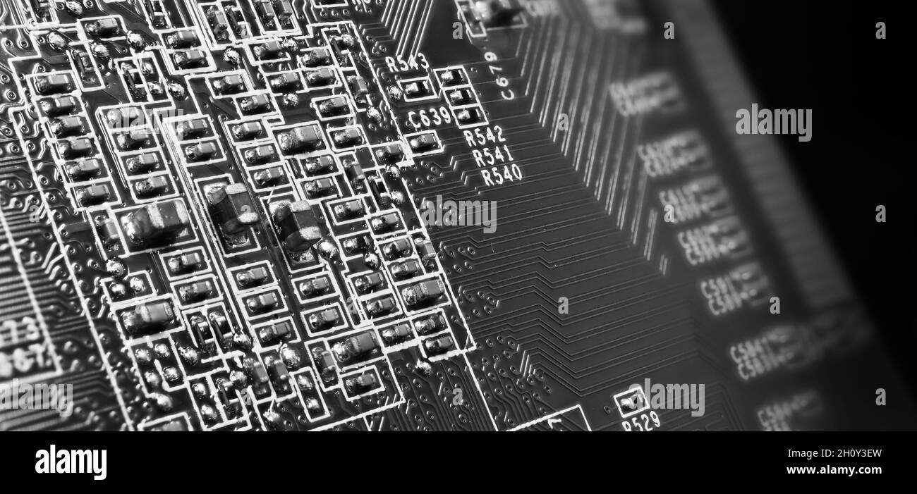 Semiconductor. cpu chip located on the green motherboard of the computer. Semi conductor motherboard circuit board. Hightech computer board with manuf Stock Photo