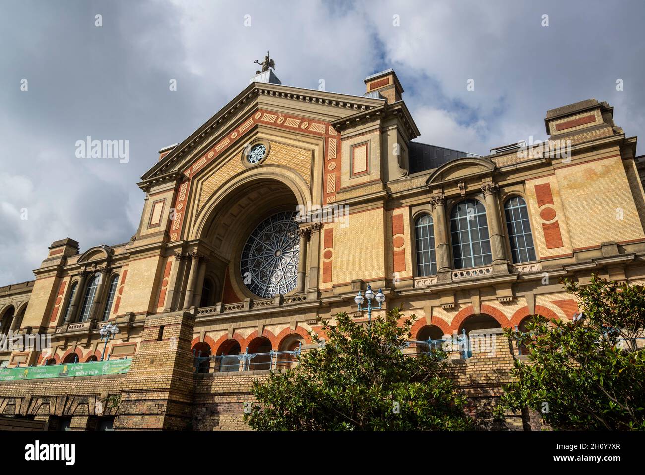 South facade with rose window of the Alexandra Palace, an entertainment and sports venue known as The People's Palace" and Ally Pally, London, UK Stock Photo