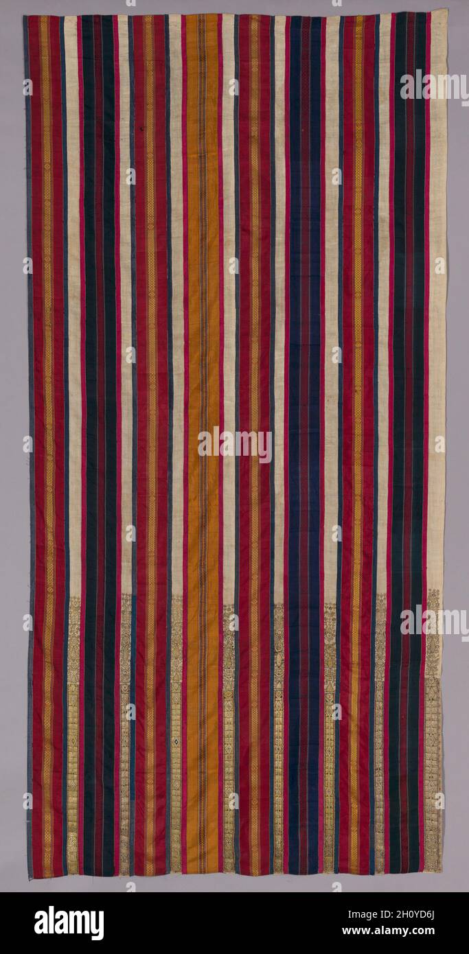 Curtain, 1600s–1700s. Africa, North Africa, Tunisia, Djerba, Tunisian weaver(s) and embroiderer(s). Silk, linen, metal, and dye; overall: 276.8 x 136.7 cm (109 x 53 13/16 in.).  One of a pair, this curtain displays colorful silk bands with woven geometric motifs, and cream bands with gold-embroidered plants, birds, six-pointed stars, and the khamsah (????), an open five-fingered hand. Birds and the tree of life were popular good luck or fertility symbols linked to marriage. This curtain’s cosmopolitan motifs would have resonated with Jews, Muslims, and Christians alike, reflecting its creation Stock Photo