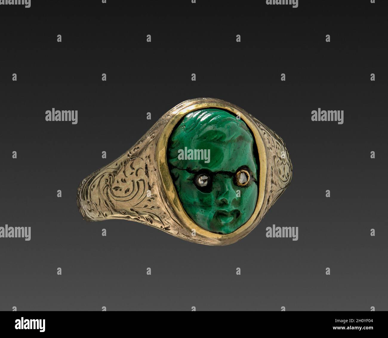 Ring, c. 1870. America ?, 19th century. Gold band with green stone head set with diamond chips; diameter: 1.8 cm (11/16 in.). Stock Photo