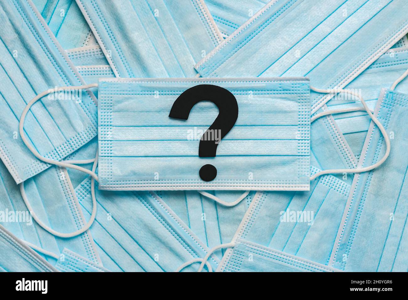 Protective surgical masks with the question mark symbol in the center ...