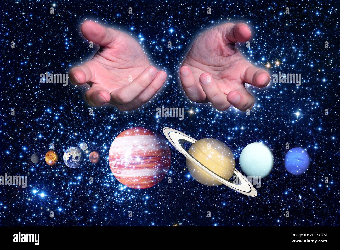 hands and solar system planets Stock Photo